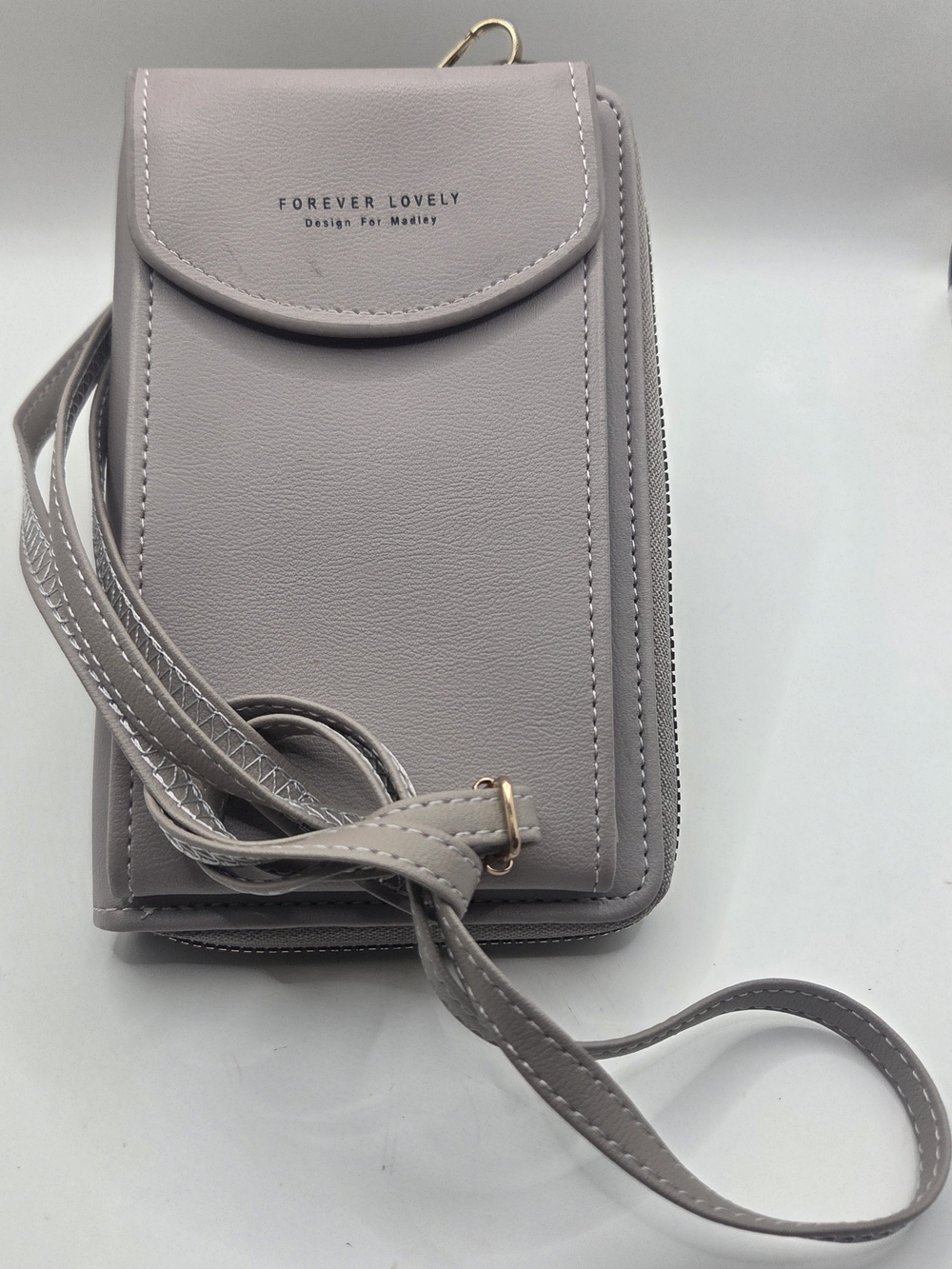 "Forever Lovely" cell phone crossbody bag featuring a snap flap pocket